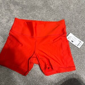 Athleta Interval 5” Stash Pocket Shorts in Bright Red
